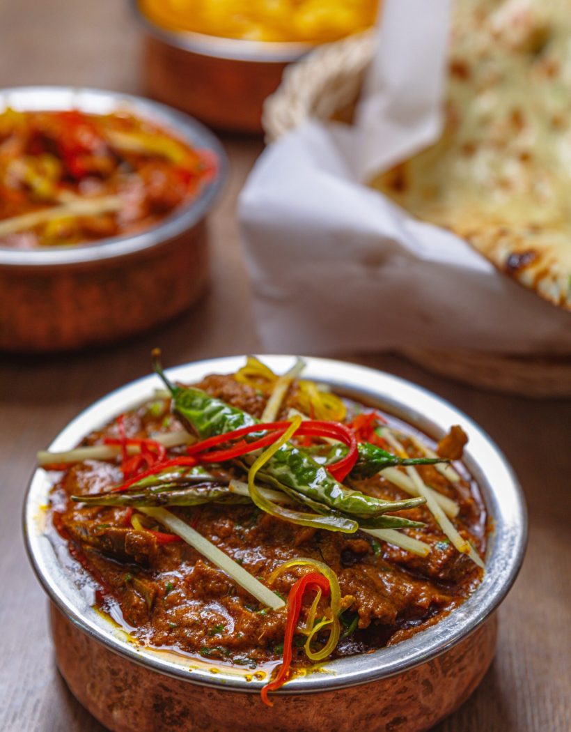 A shallow focus shot of Indian spicy Rojan josh on a table